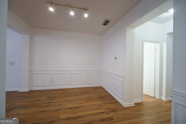 a kitchen with a stove and a refrigerator