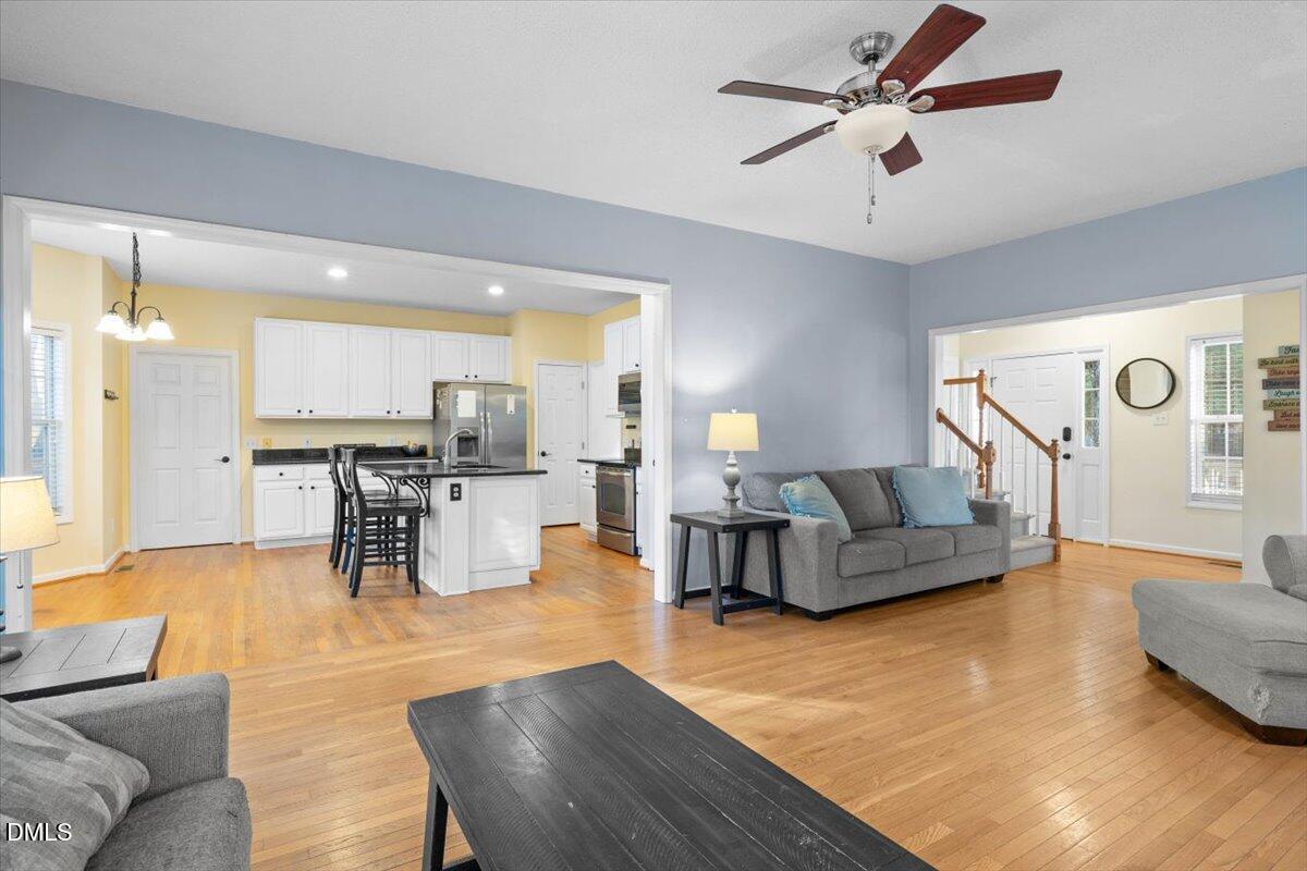6512 Cablewood Drive Raleigh, NC 27603 - Photo 10 of 41 a living room with furniture and kitchen view