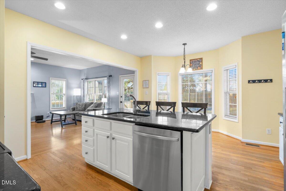 6512 Cablewood Drive Raleigh, NC 27603 - Photo 14 of 41 a kitchen with sink and cabinets