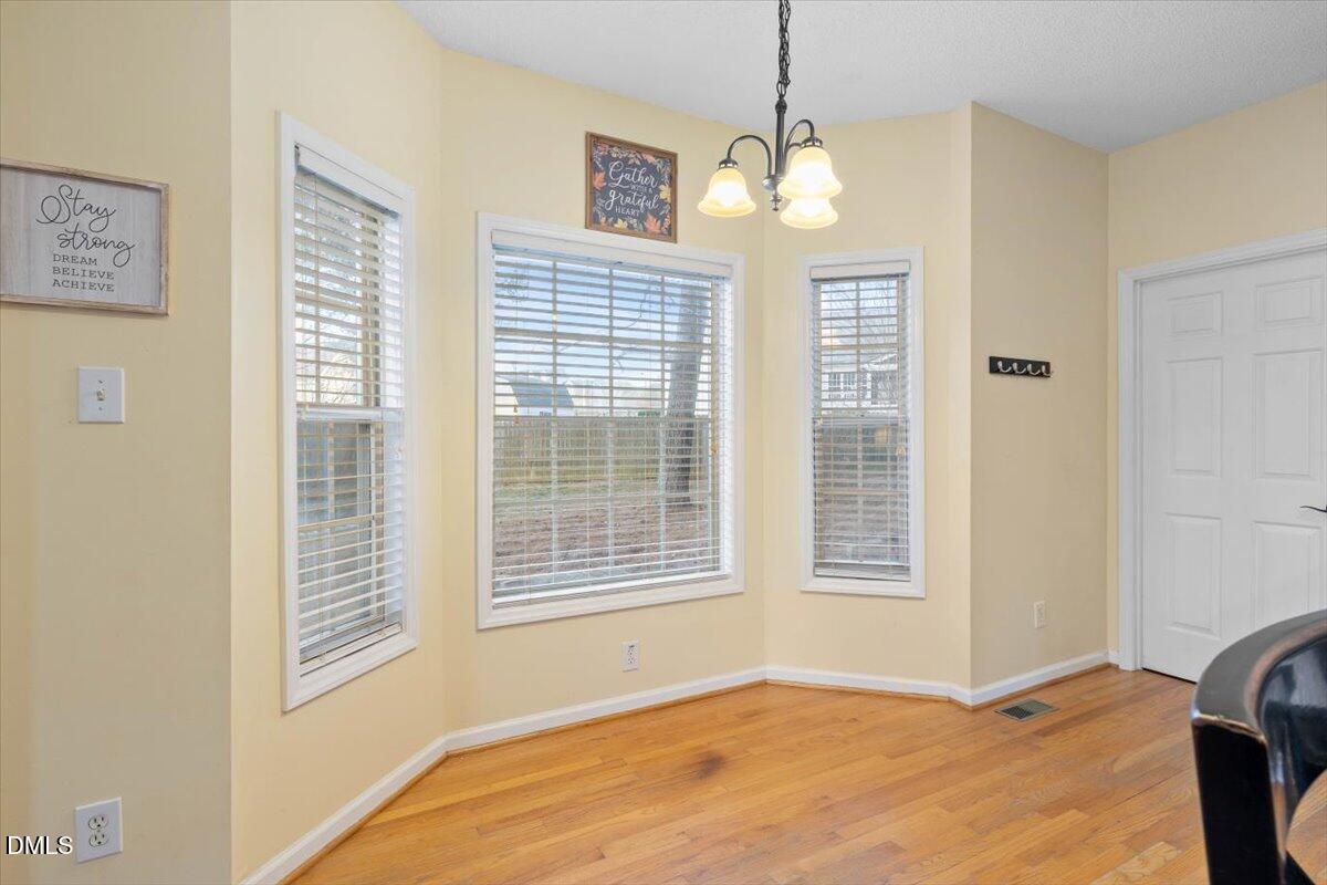6512 Cablewood Drive Raleigh, NC 27603 - Photo 16 of 41 a view of an empty room with a window