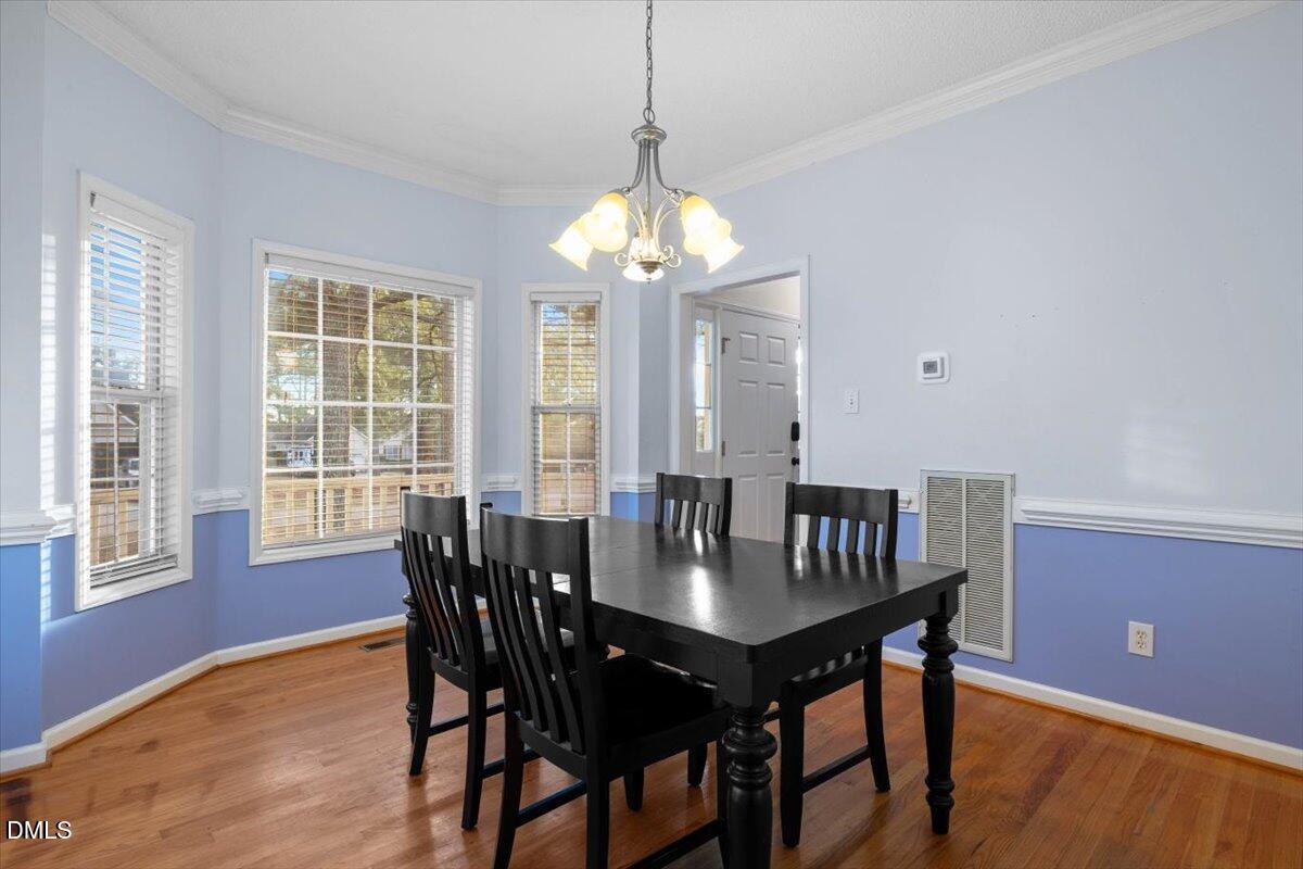 6512 Cablewood Drive Raleigh, NC 27603 - Photo 17 of 41 a view of a dining room with furniture window and outside view