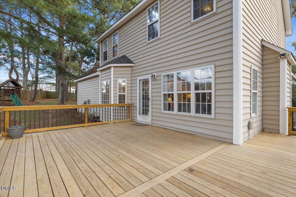6512 Cablewood Drive Raleigh, NC 27603 - Photo 33 of 41 a view of backyard with deck and wooden floor