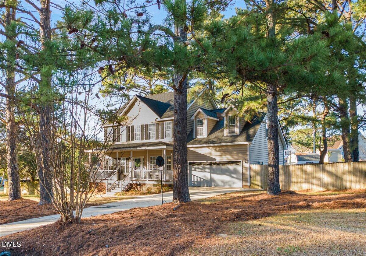 6512 Cablewood Drive Raleigh, NC 27603 - Photo 4 of 41 a view of a house with a tree in the yard
