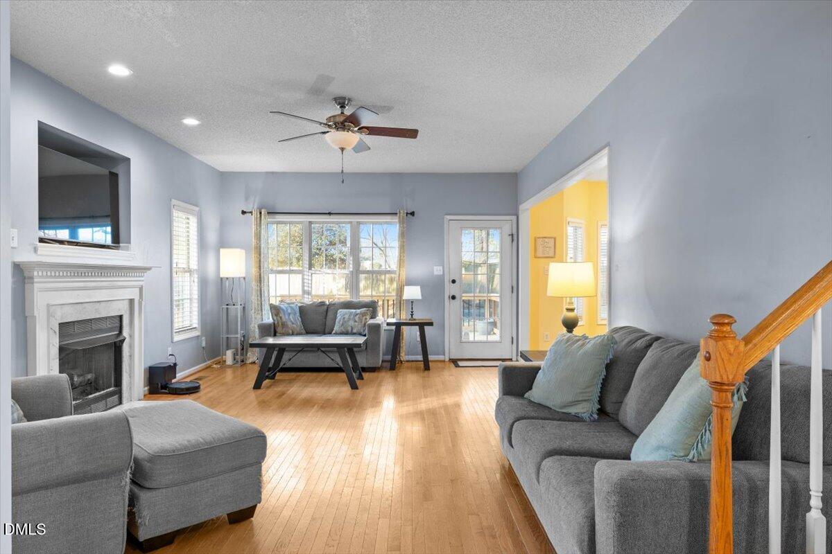 6512 Cablewood Drive Raleigh, NC 27603 - Photo 8 of 41 a living room with furniture and a fireplace