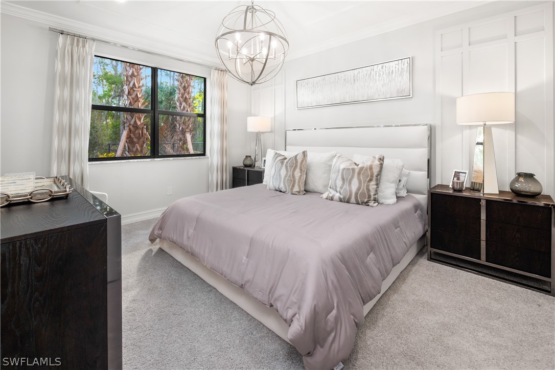 7587 Morgan Way Naples, FL 34119 - Photo 12 of 29 a bedroom with a large bed and a window