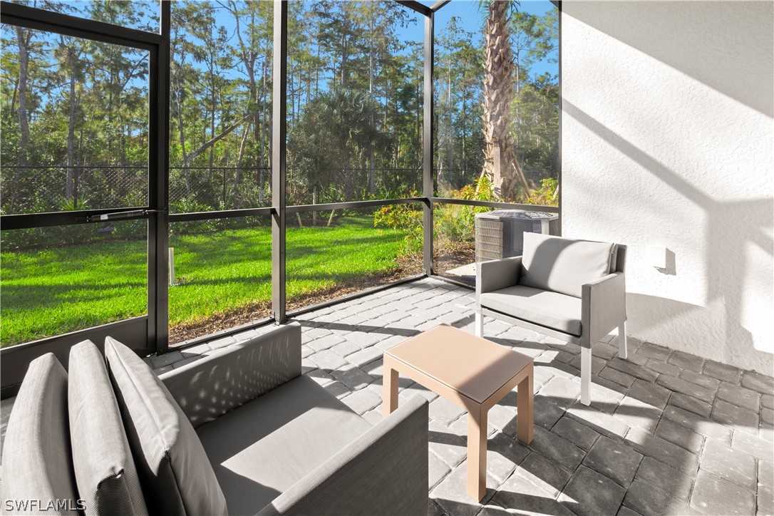 7587 Morgan Way Naples, FL 34119 - Photo 3 of 29 a view of a patio with a yard