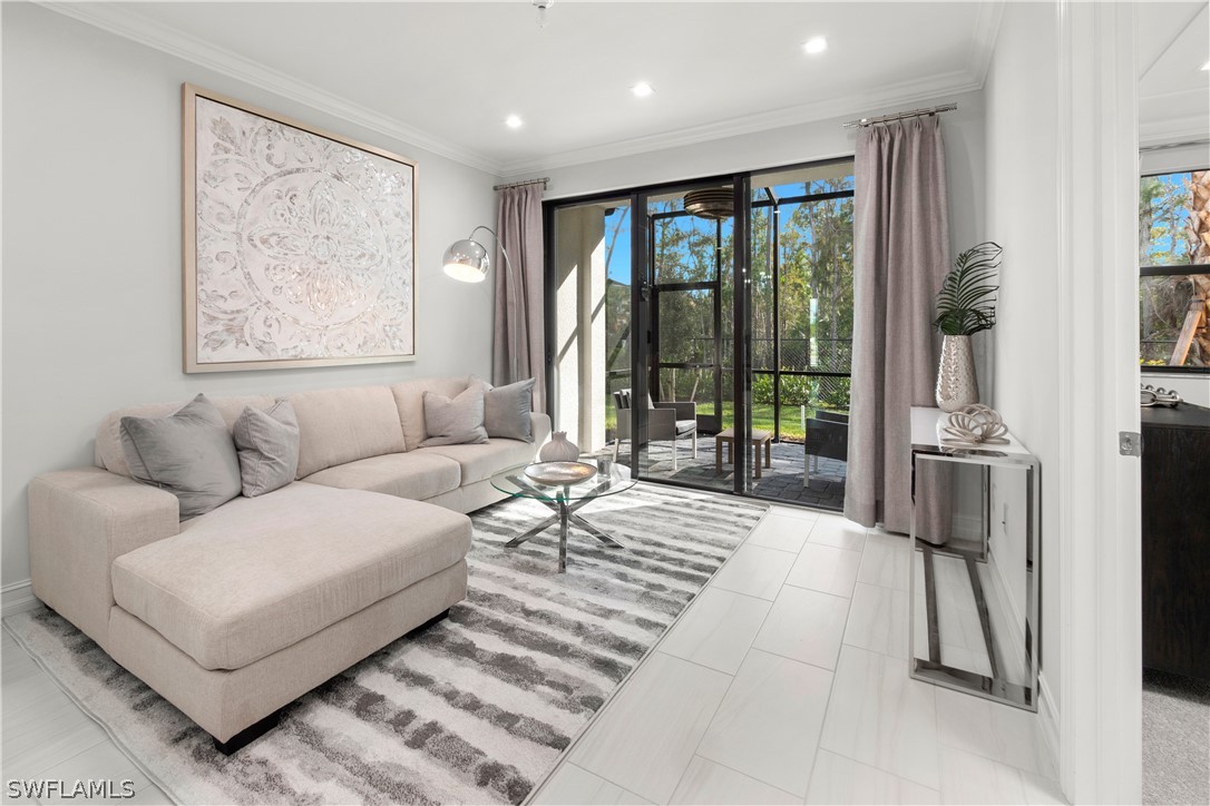7587 Morgan Way Naples, FL 34119 - Photo 10 of 29 a living room with furniture and large window
