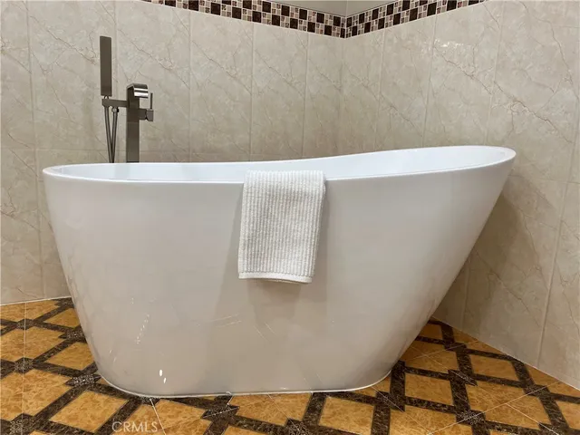 a view of a bath tub sitting in a bathroom