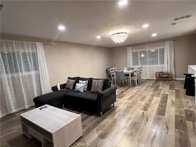 a living room with furniture and a table