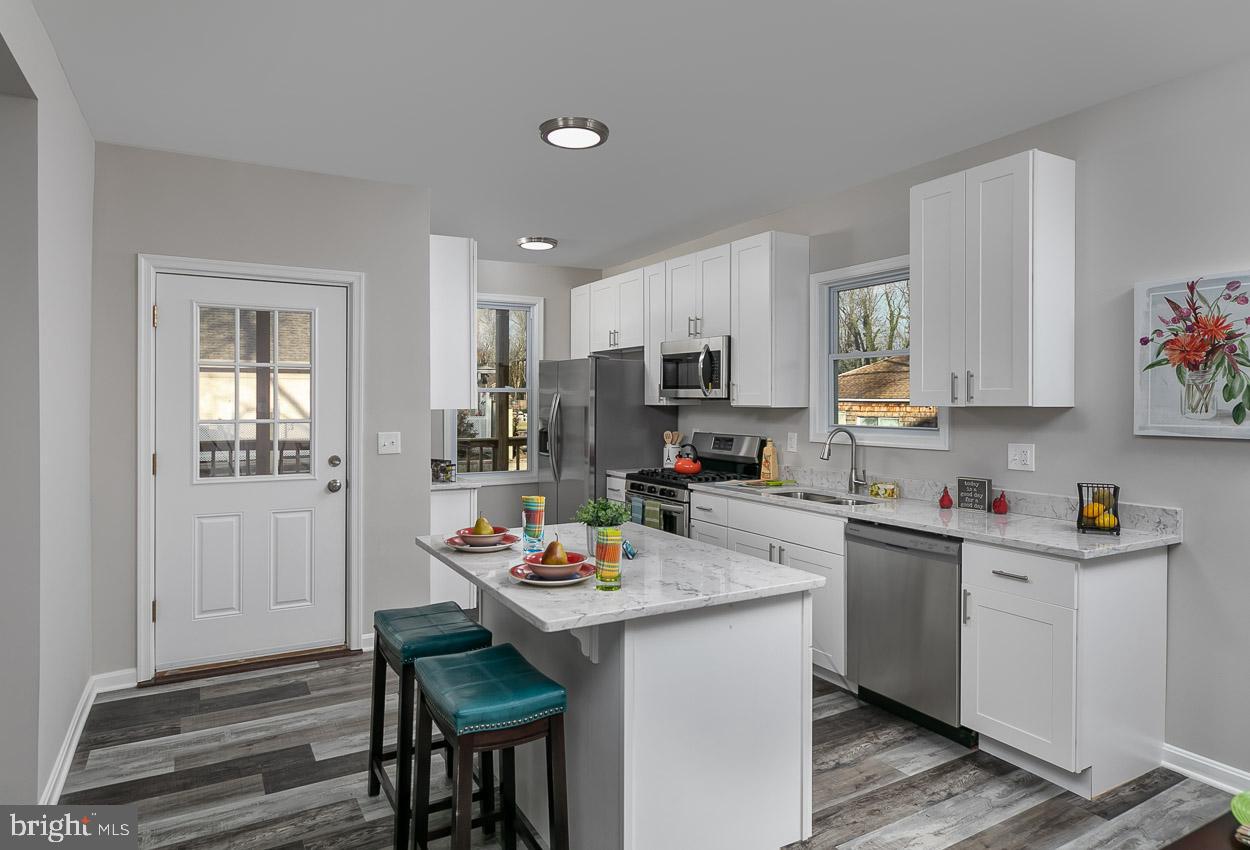 210 West Maple Road Linthicum Heights, MD 21090 - Photo 18 of 46 Kitchen with Walk-Out to Deck perfect to Entertain
