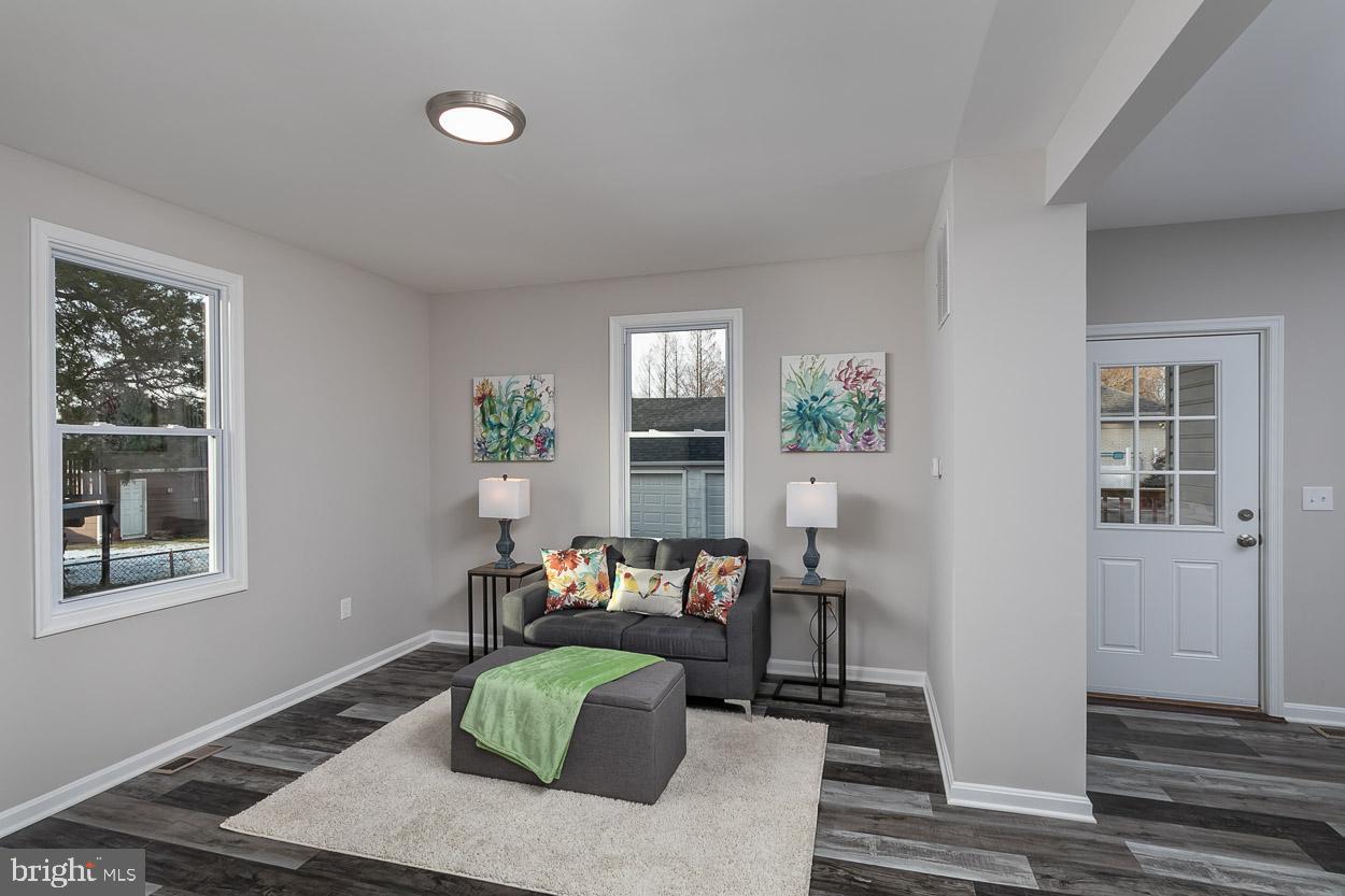 210 West Maple Road Linthicum Heights, MD 21090 - Photo 21 of 46 Lustrous Luxury Vinyl Tile Flooring Throughout