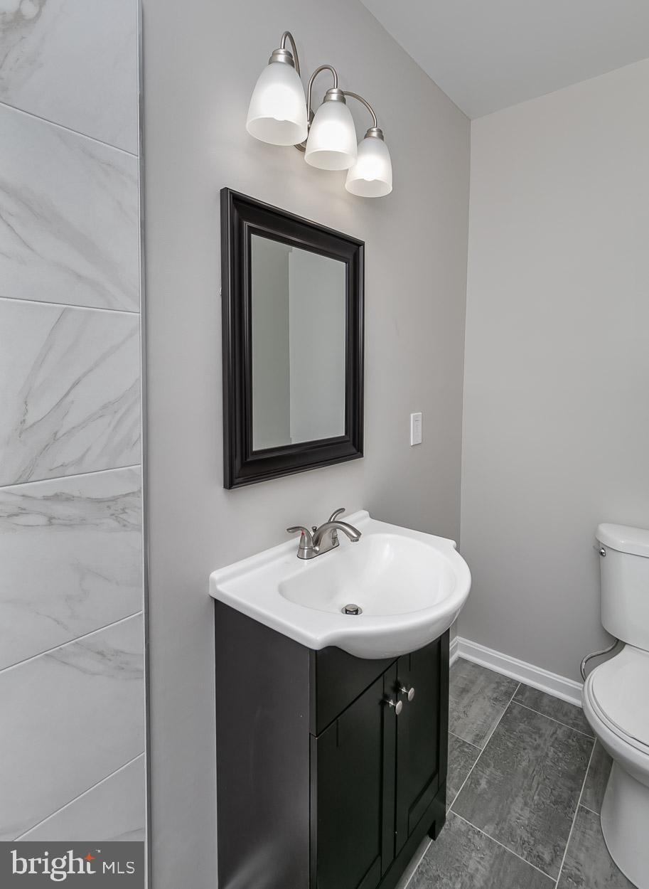 210 West Maple Road Linthicum Heights, MD 21090 - Photo 37 of 46 Chic fixtures and new vanity in Master Bath