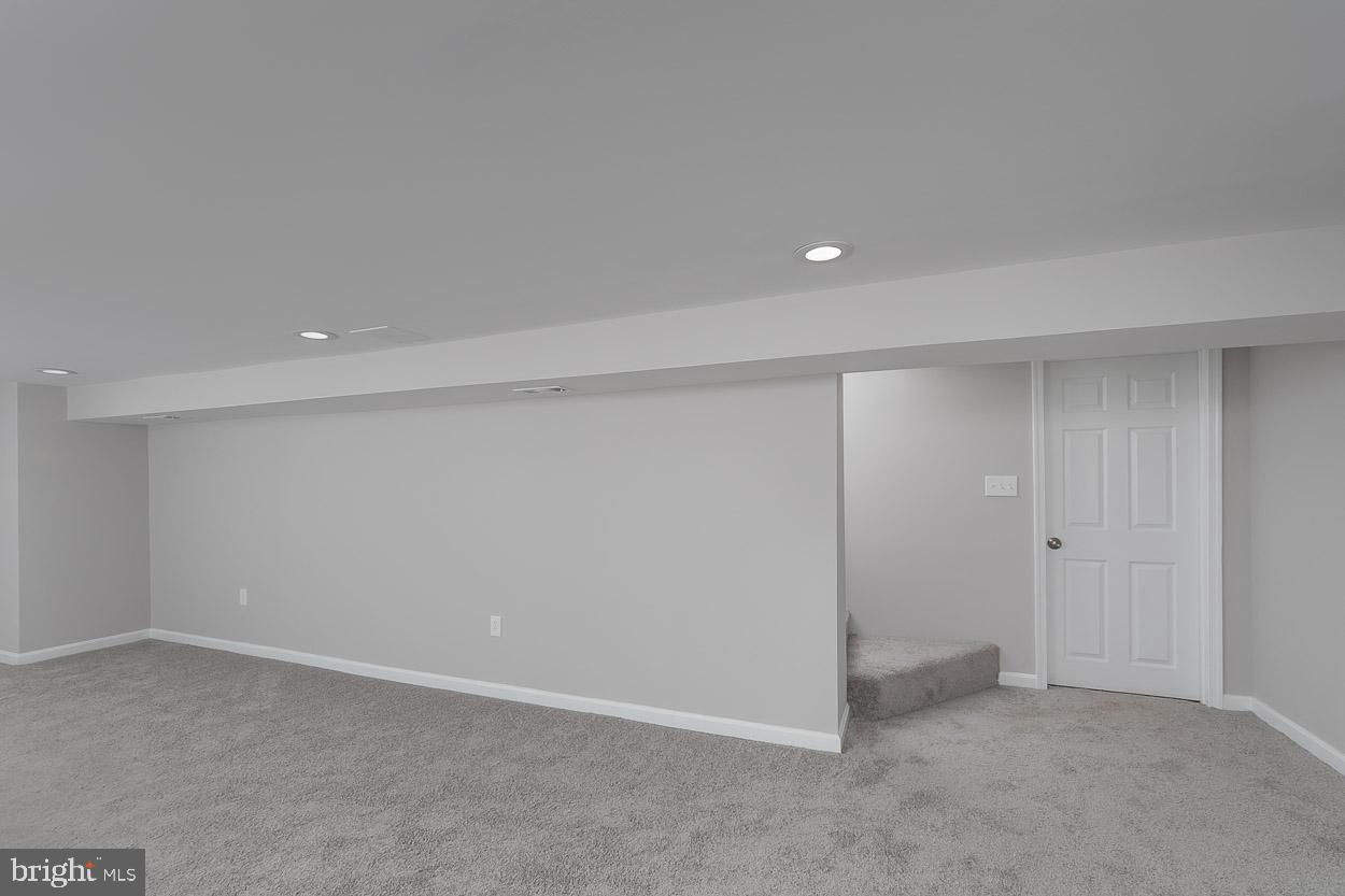 210 West Maple Road Linthicum Heights, MD 21090 - Photo 45 of 46 Family room w/ recessed lighting & plush carpeting