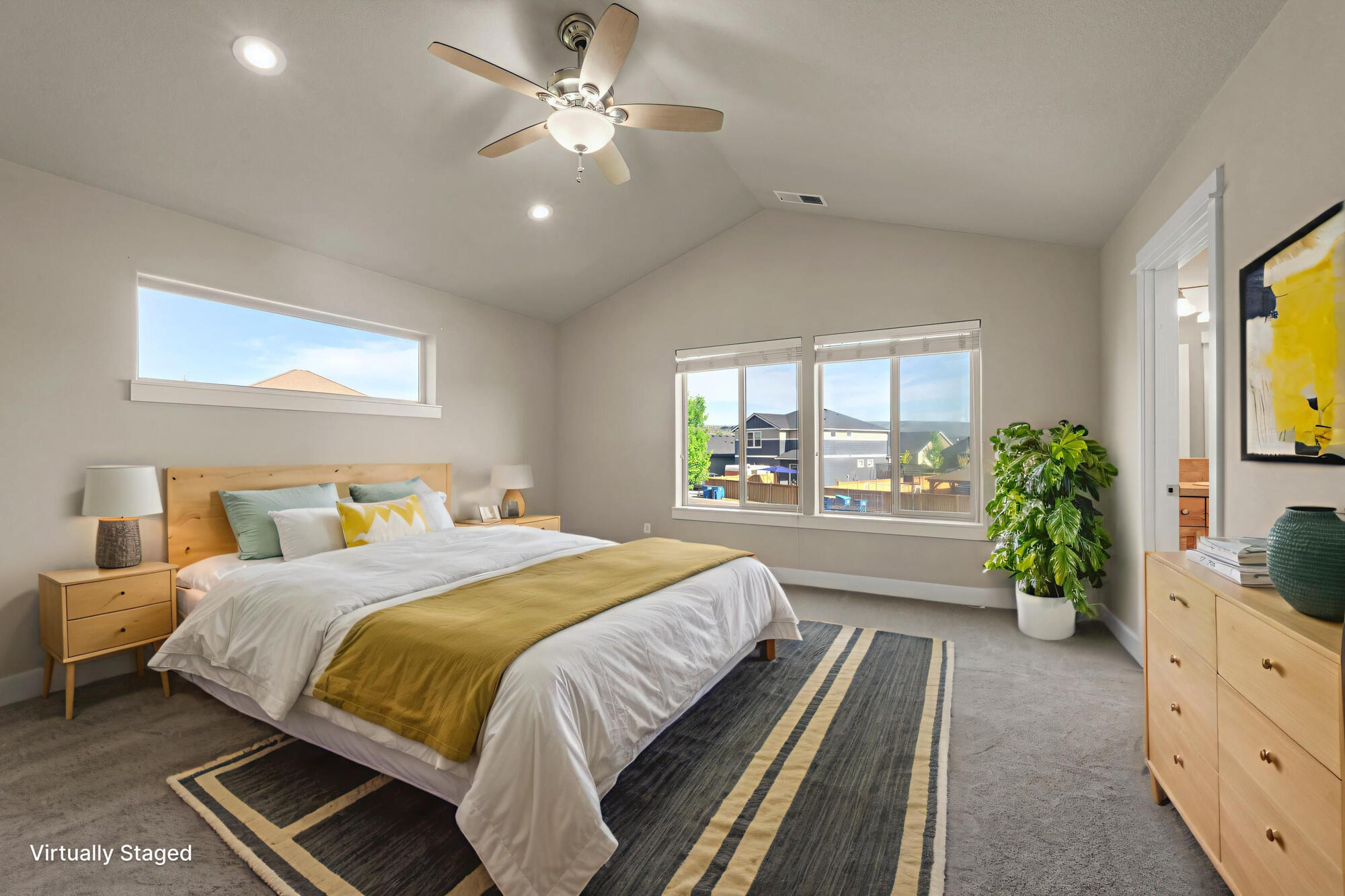 1402 Northeast Hudspeth Road Prineville, OR 97754 - Photo 14 of 36 a bedroom with a large bed and a chandelier