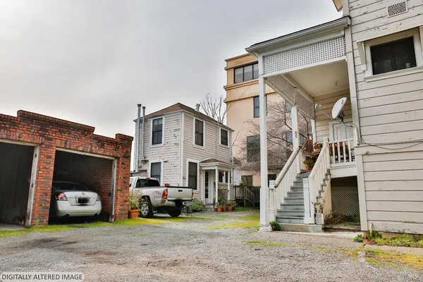 a view of a car park in front of house