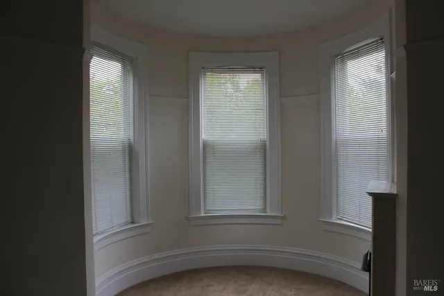 a view of empty room with windows