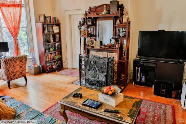 a room with furniture and a flat screen tv