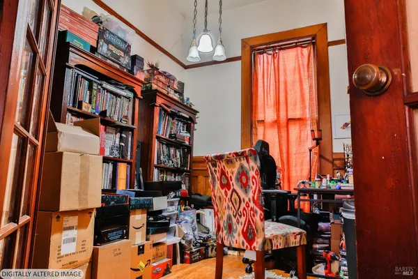 a view of staircase with a small kitchen