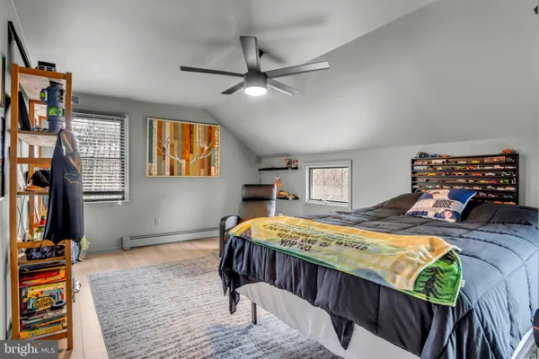 a bedroom with bed and a window