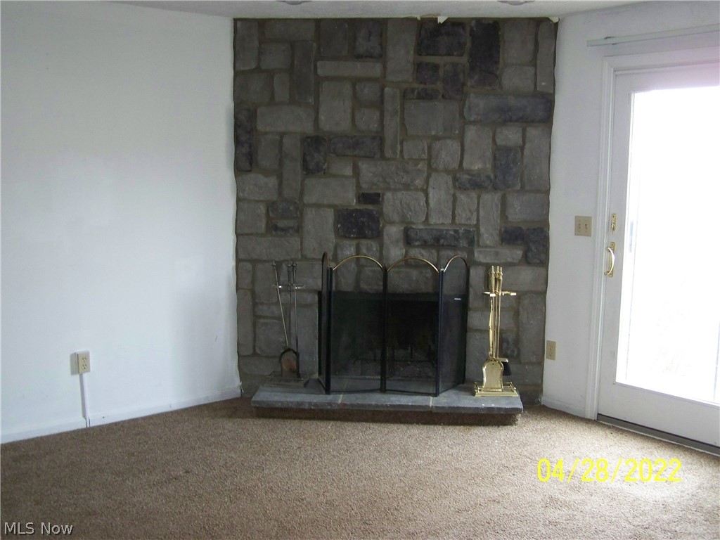 4535 Grayton Road, Unit 73 Cleveland, OH 44135 - Photo 2 of 4 Living room has a wood burning fireplace