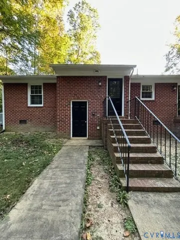 a front view of house with stairs