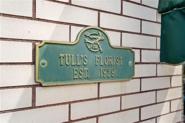 a sign on a pole on a street