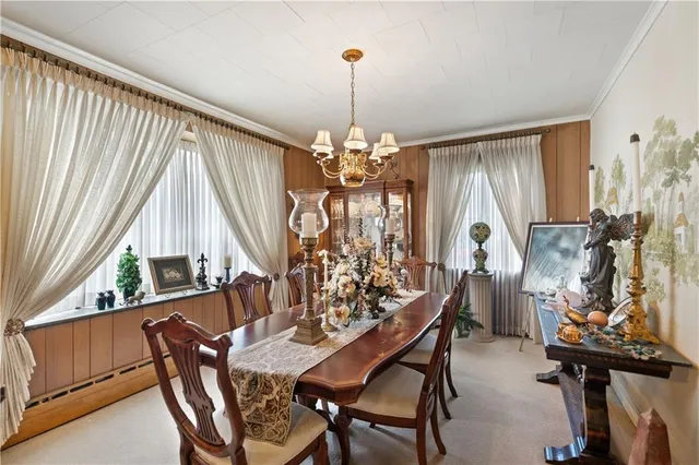 a view of a dining room with furniture and window