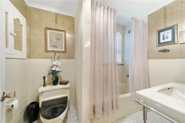 a bathroom with a sink vanity and toilet