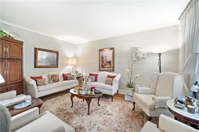 a living room with furniture lamp and rug