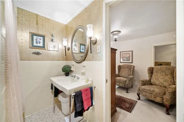 a bathroom with a sink mirror and vanity