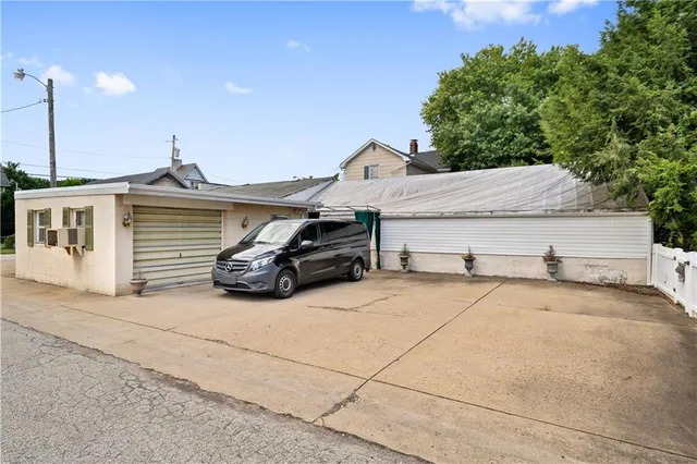 a living room with lots of furniture and a chandelier