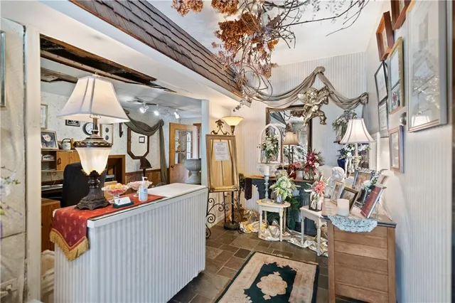 a room with furniture a rug and a chandelier