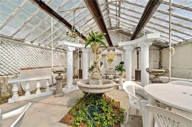 a view of a patio with table and chairs