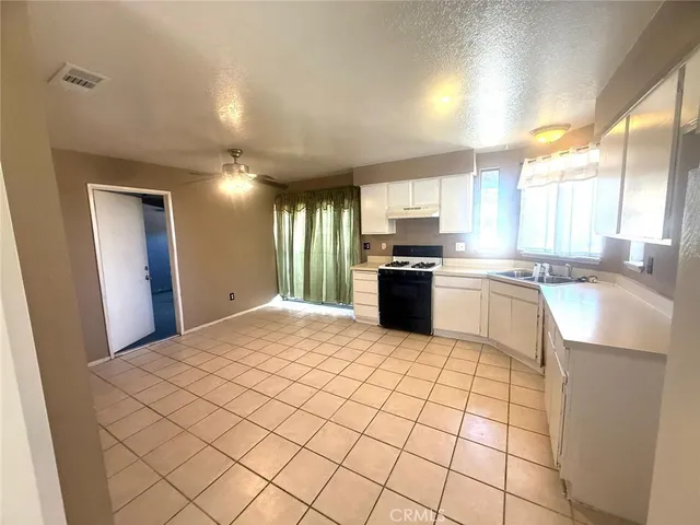 a view of an empty room and a window