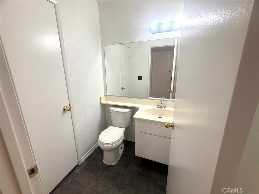 495 West 13th Street Perris, CA 92570 - Photo 23 of 32 a bathroom with a sink toilet and shower