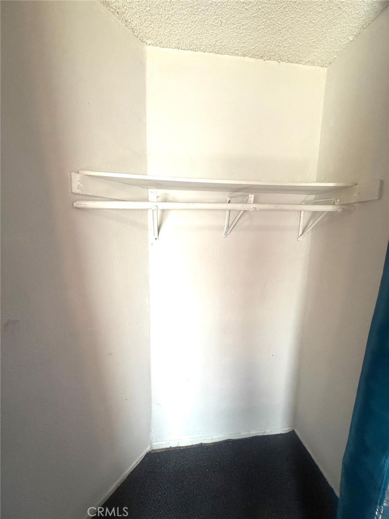 495 West 13th Street Perris, CA 92570 - Photo 28 of 32 a view of small space with racks on the wall