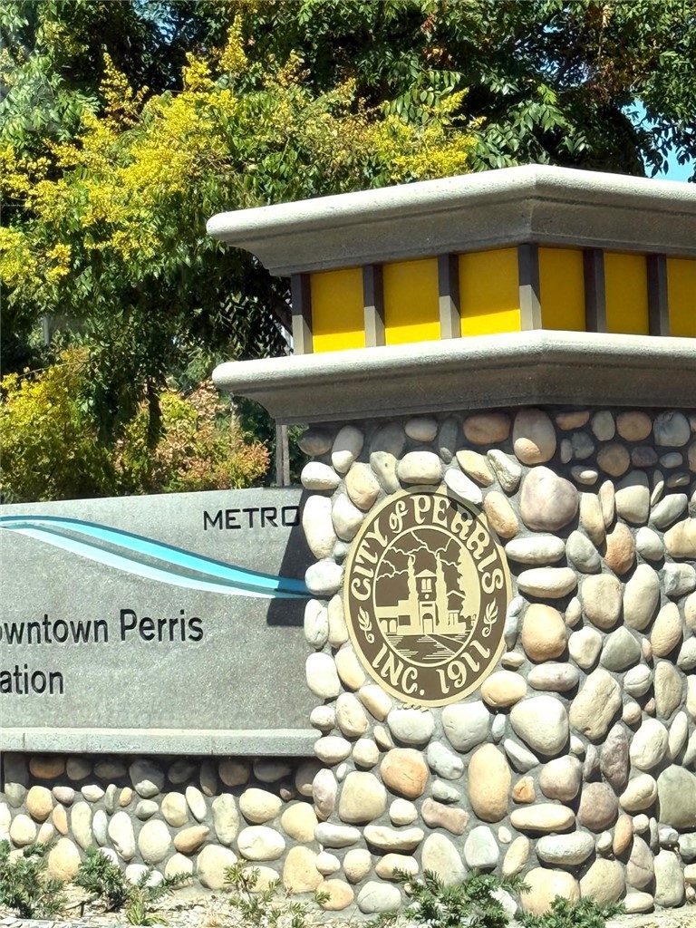 495 West 13th Street Perris, CA 92570 - Photo 3 of 32 a view of a sign board with an outdoor space