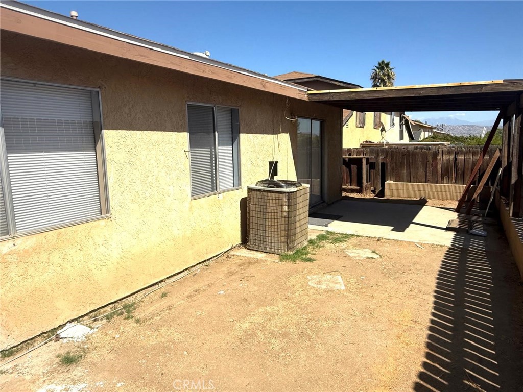 495 West 13th Street Perris, CA 92570 - Photo 10 of 32 a view of a living room with a balcony and furniture