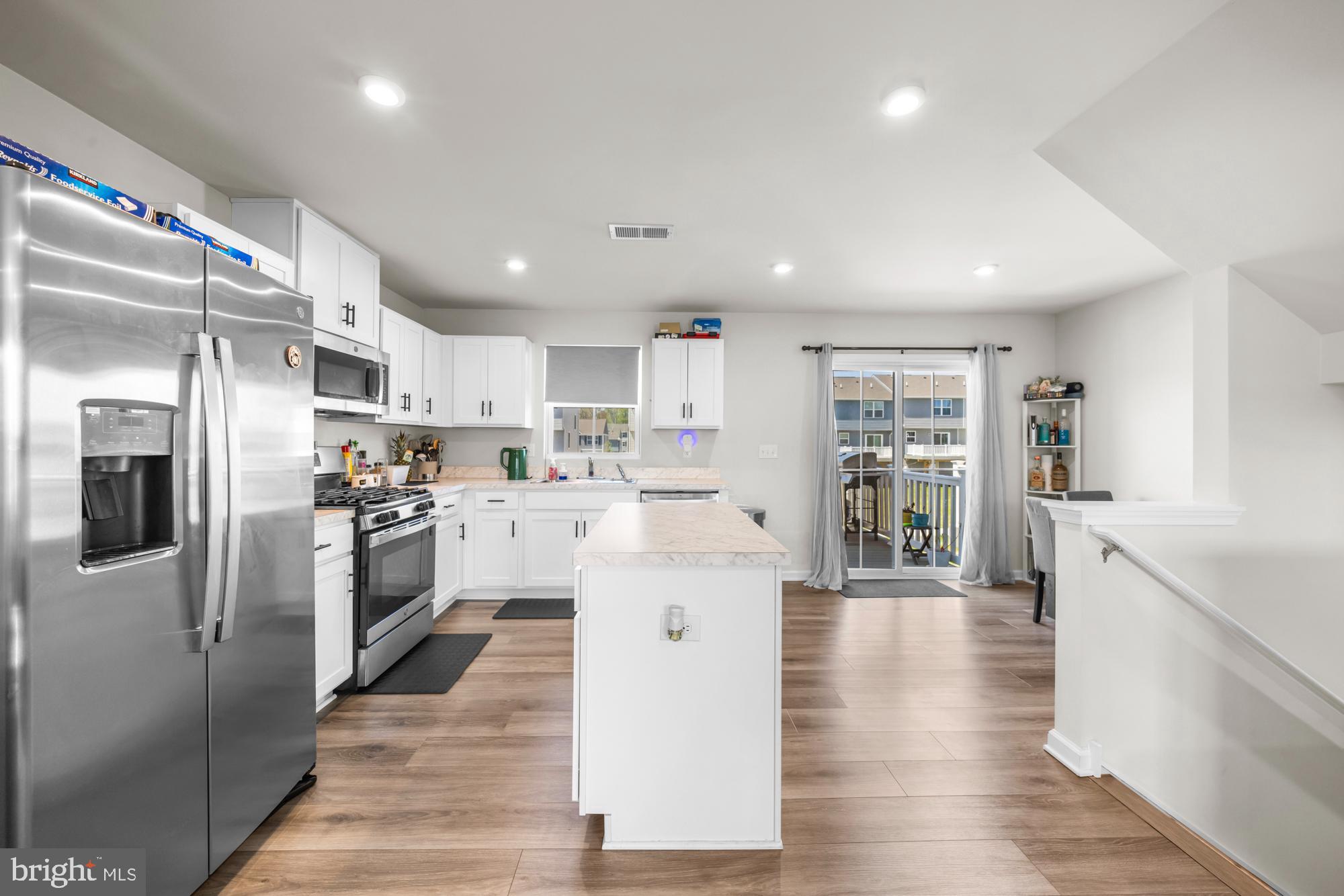 11 Mulberry Lane Clementon, NJ 08021 - Photo 12 of 32 a large kitchen with stainless steel appliances lots of counter space and a refrigerator