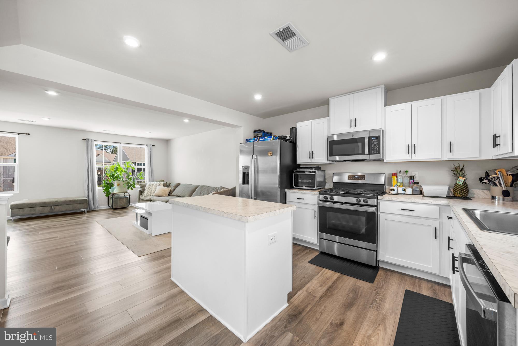 11 Mulberry Lane Clementon, NJ 08021 - Photo 15 of 32 a kitchen with white cabinets and stainless steel appliances