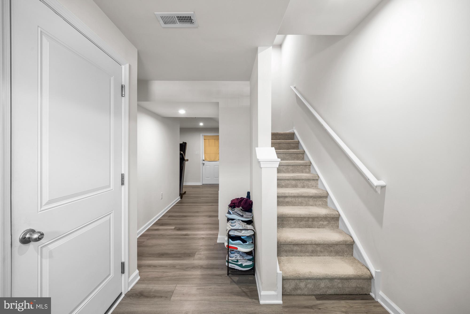 11 Mulberry Lane Clementon, NJ 08021 - Photo 3 of 32 a view of a hallway with wooden floor and entryway