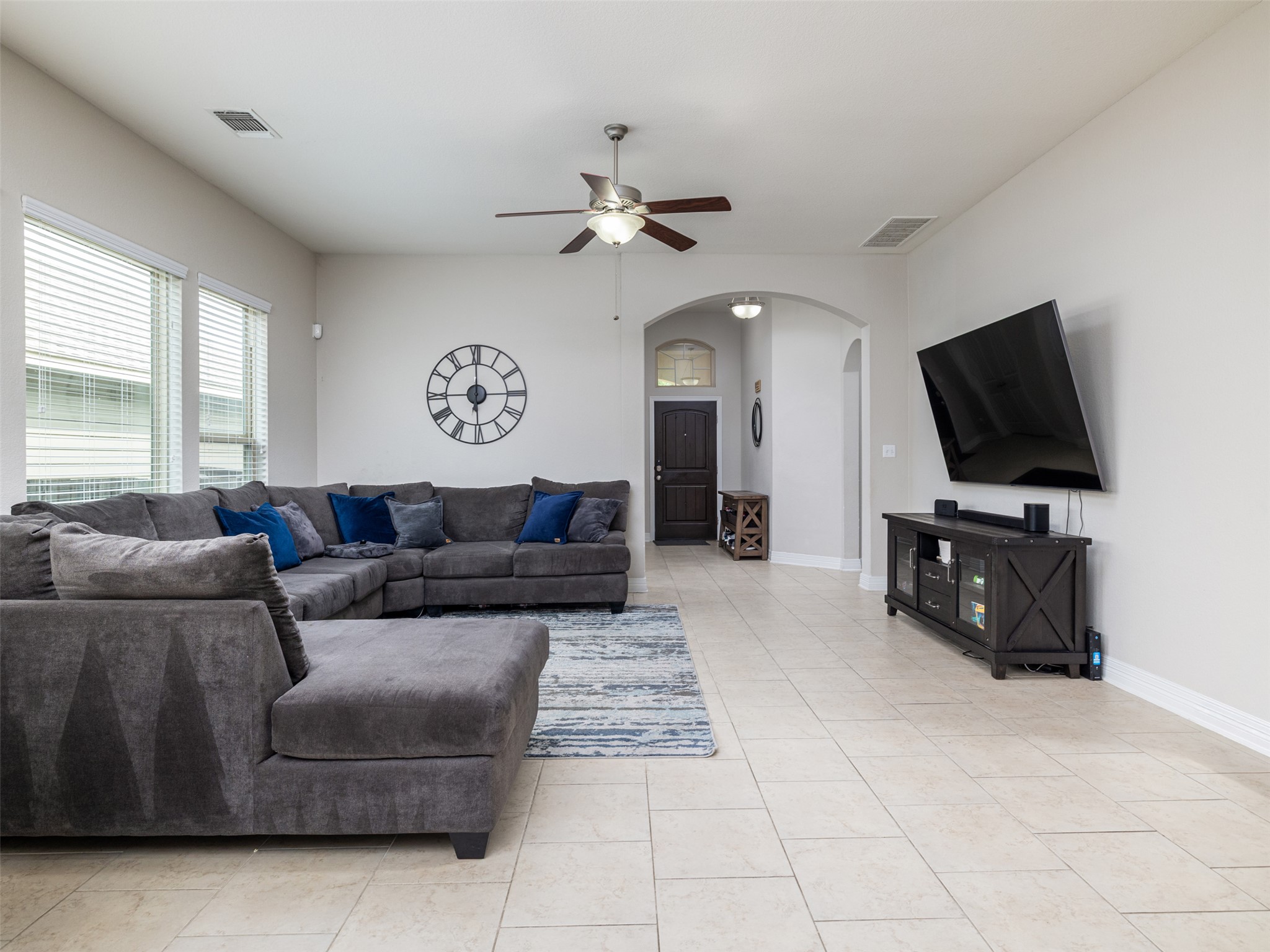 717 Blue Agave Lane Georgetown, TX 78626 - Photo 5 of 28 a living room with furniture and a flat screen tv