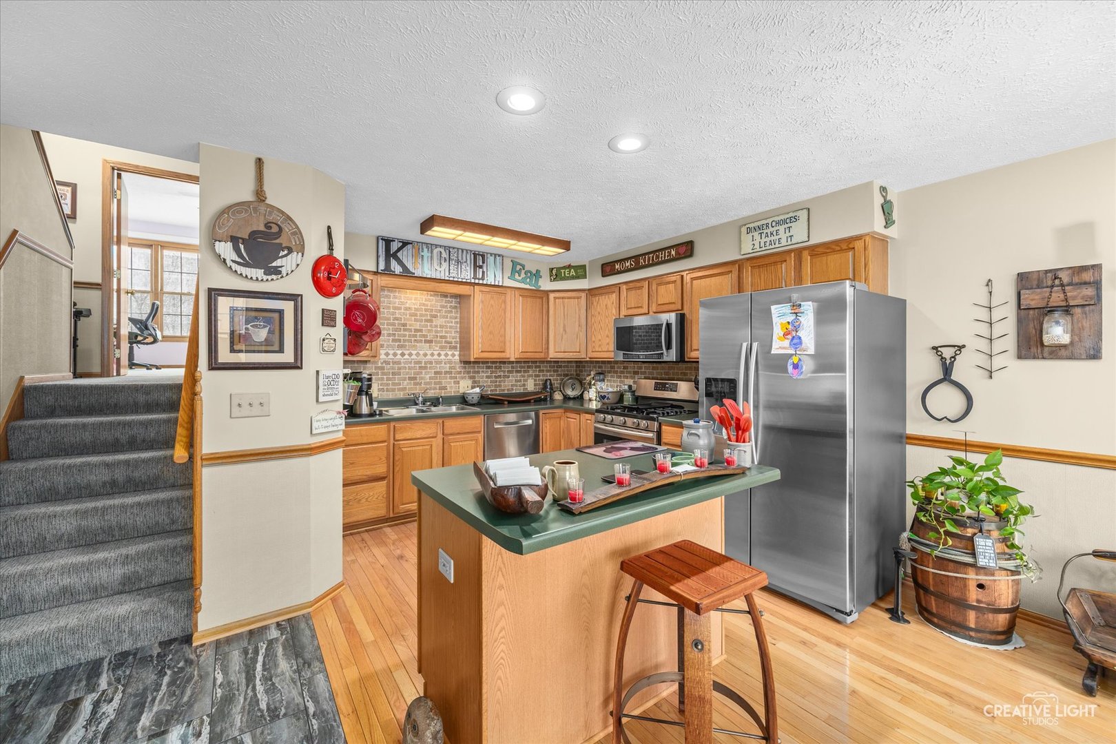 470 South Peace Road Sycamore, IL 60178 - Photo 11 of 25 a kitchen with stainless steel appliances granite countertop a refrigerator and a stove