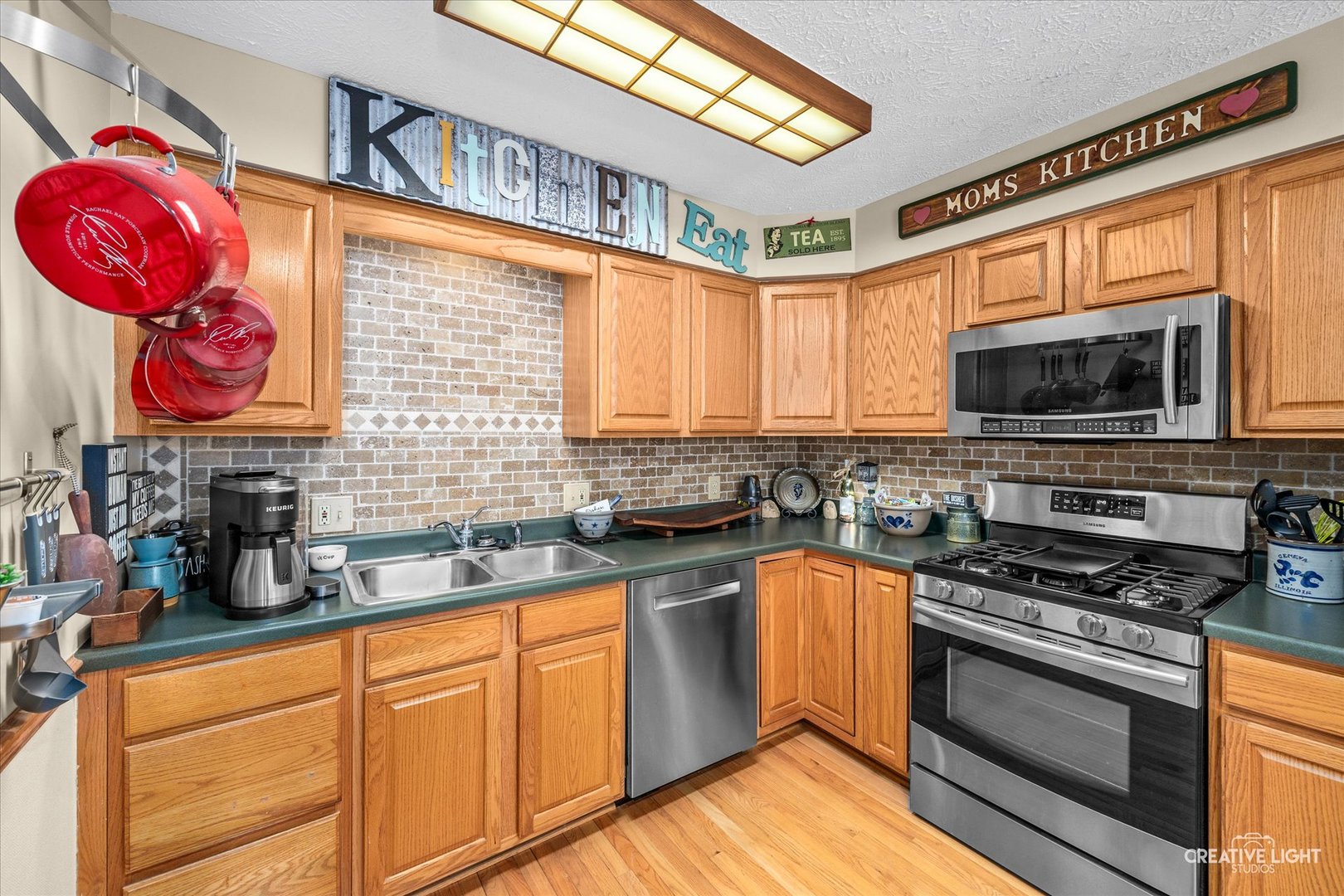 470 South Peace Road Sycamore, IL 60178 - Photo 12 of 25 a kitchen with stainless steel appliances granite countertop a stove sink and microwave