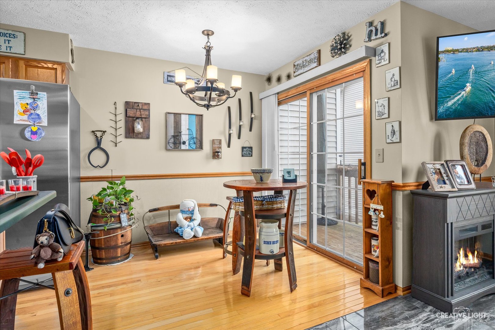 470 South Peace Road Sycamore, IL 60178 - Photo 9 of 25 a living room with furniture a dining table and a fireplace