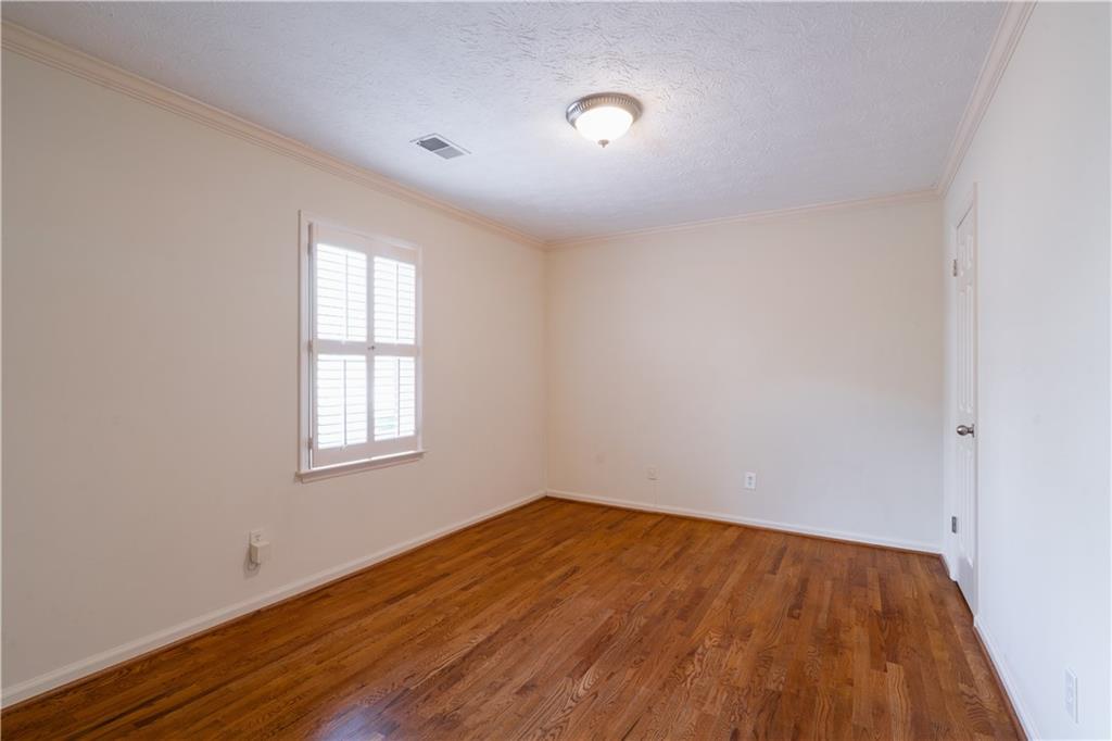 1307 Whitlock Ridge Drive Marietta, GA 30064 - Photo 15 of 29 an empty room with wooden floor and windows