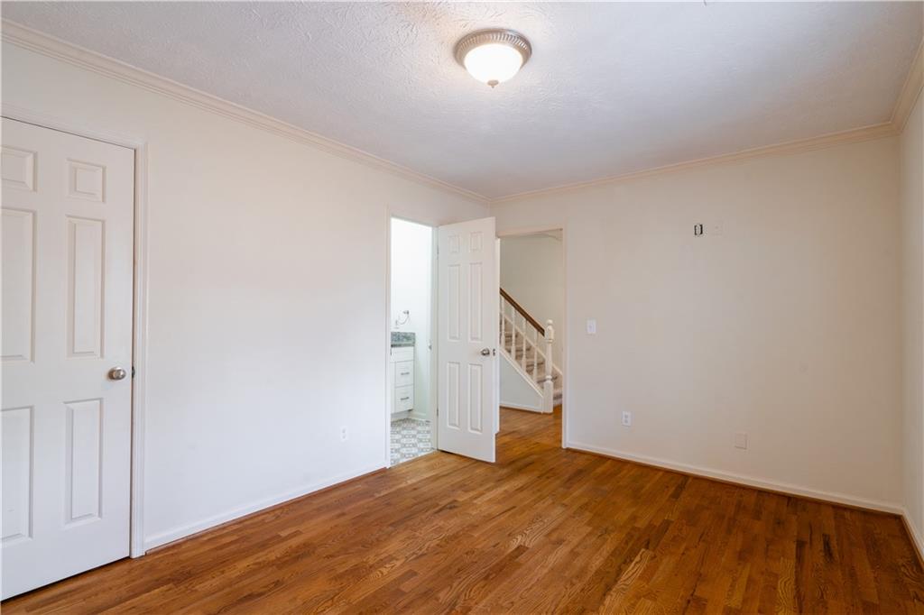 1307 Whitlock Ridge Drive Marietta, GA 30064 - Photo 16 of 29 a view of an empty room with wooden floor