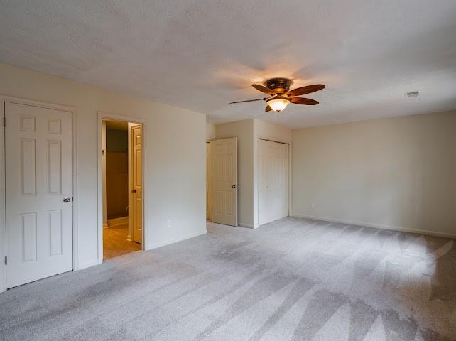1307 Whitlock Ridge Drive Marietta, GA 30064 - Photo 22 of 29 a view of an empty room with a ceiling fan
