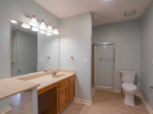 1307 Whitlock Ridge Drive Marietta, GA 30064 - Photo 25 of 29 a bathroom with a toilet sink and mirror