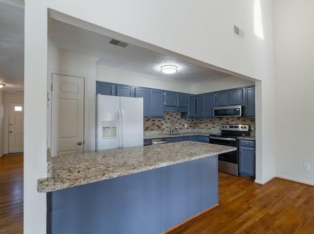 1307 Whitlock Ridge Drive Marietta, GA 30064 - Photo 7 of 29 a kitchen with stainless steel appliances granite countertop a stove a sink and a refrigerator